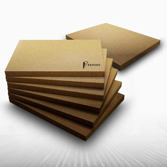 Two vermiculite fire chamber boards measuring 400 by 300 millimetres at 30 millimetres thick