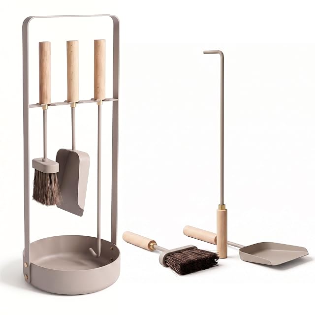 A beige Scandinavian fireplace tool set with wooden handles, brass rings and a round base dish