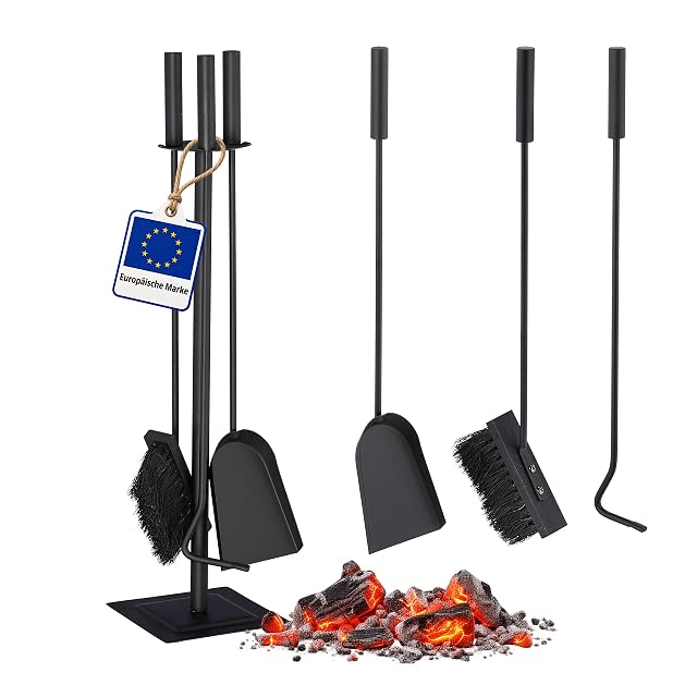 A black four-piece fireplace tool set with brush, shovel, poker and hanging stand