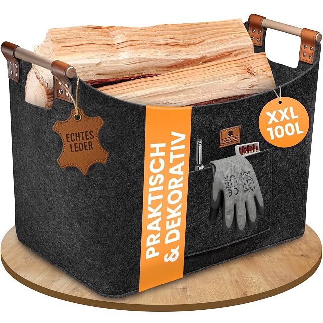 An anthracite felt log basket of 100 litres with riveted leather handles and a front pocket