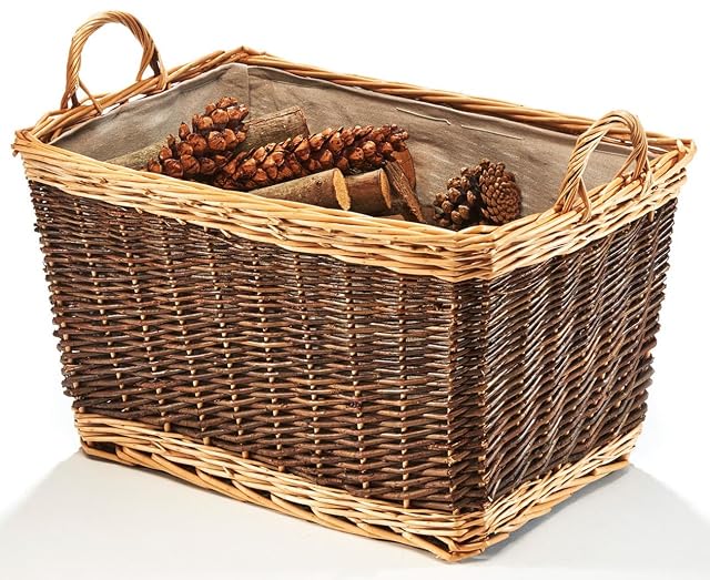 A brown woven willow log basket with a removable jute fabric liner and a sturdy handle