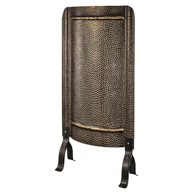 A hammered antique brass stove screen 91 centimetres tall and 46 centimetres wide